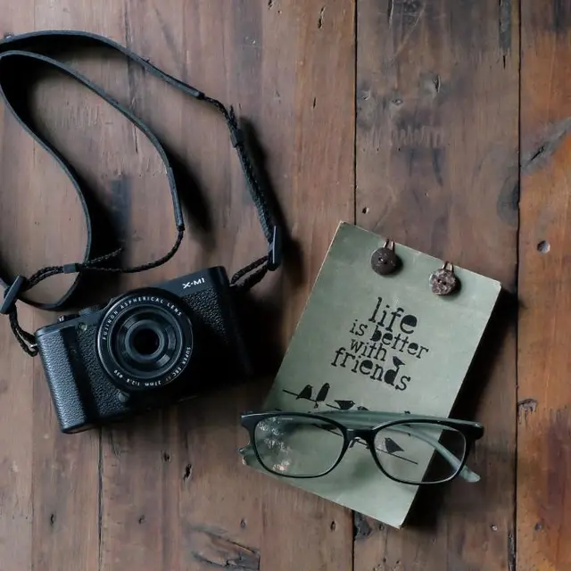Compact camera with strap