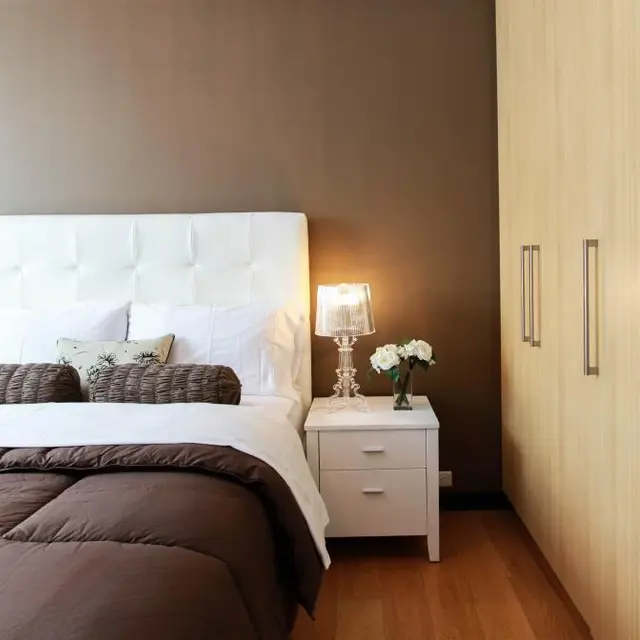 White two-drawer bedside table