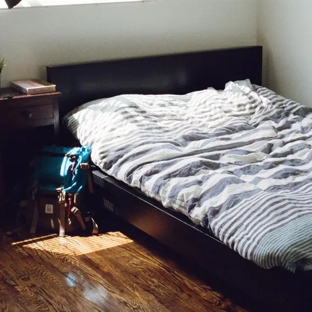 Dark-frame double bed