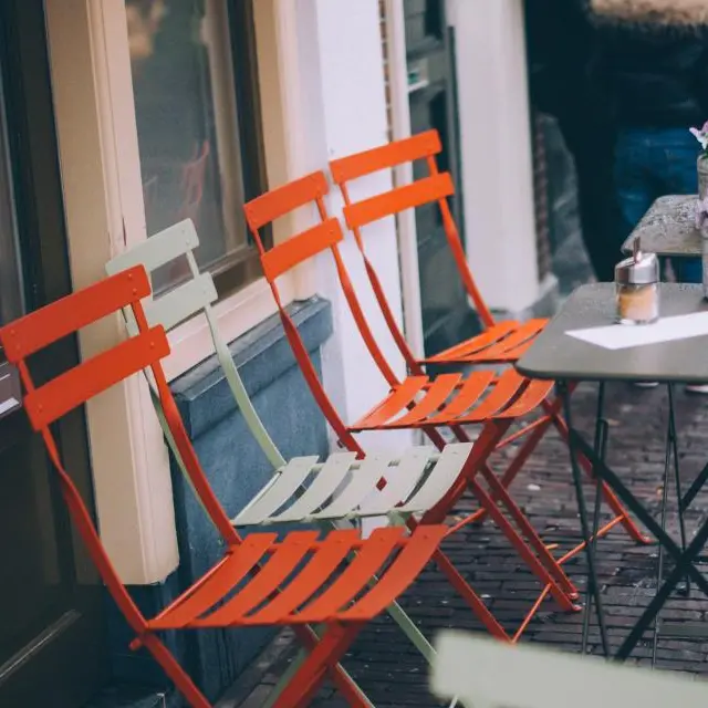 Orange folding bistro chair
